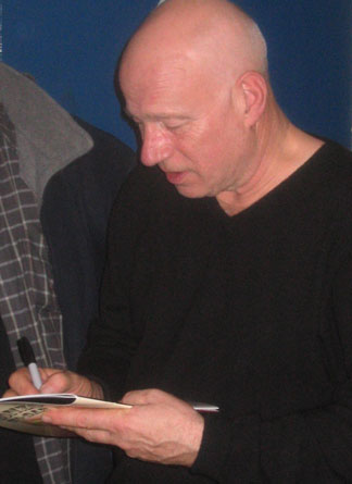 Neil Innes signs a souvenir programme